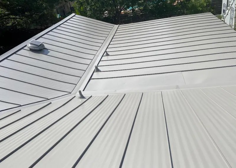 Solar attic fan installed on a metal roof for Roof Ventilation in Bear Valley Springs